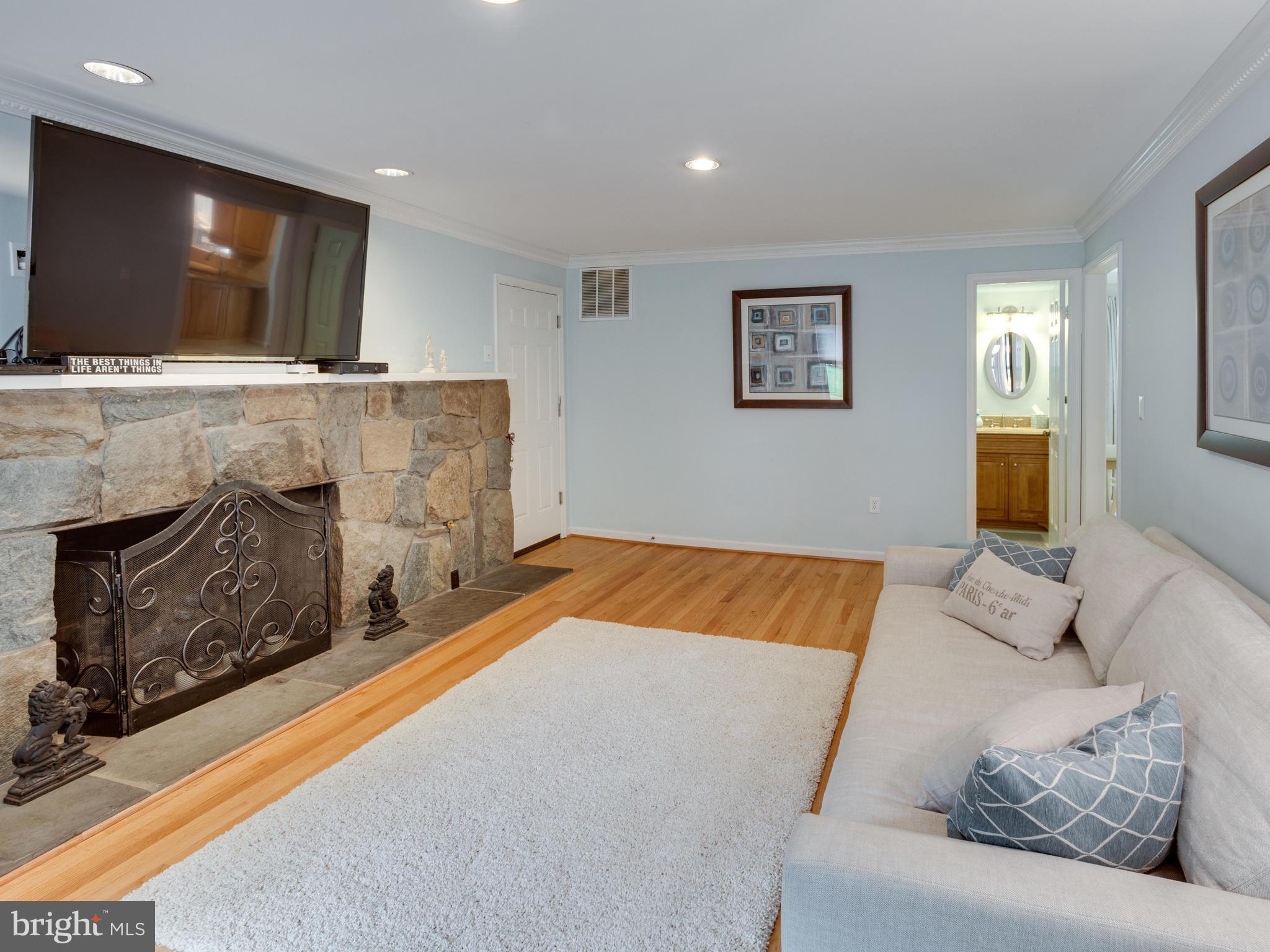 9031 Edgepark Road Vienna, VA 22182 - Photo 11 of 30 a bedroom with a bed and a television