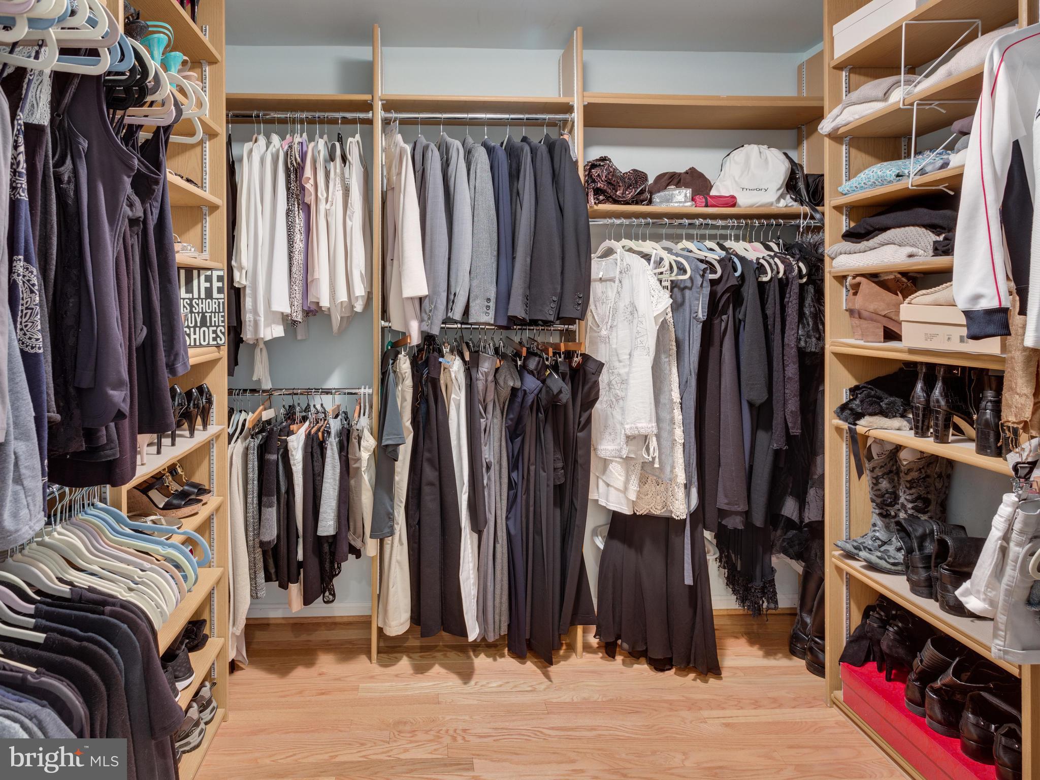 9031 Edgepark Road Vienna, VA 22182 - Photo 15 of 30 a view of walk in closet with clothes and shoes