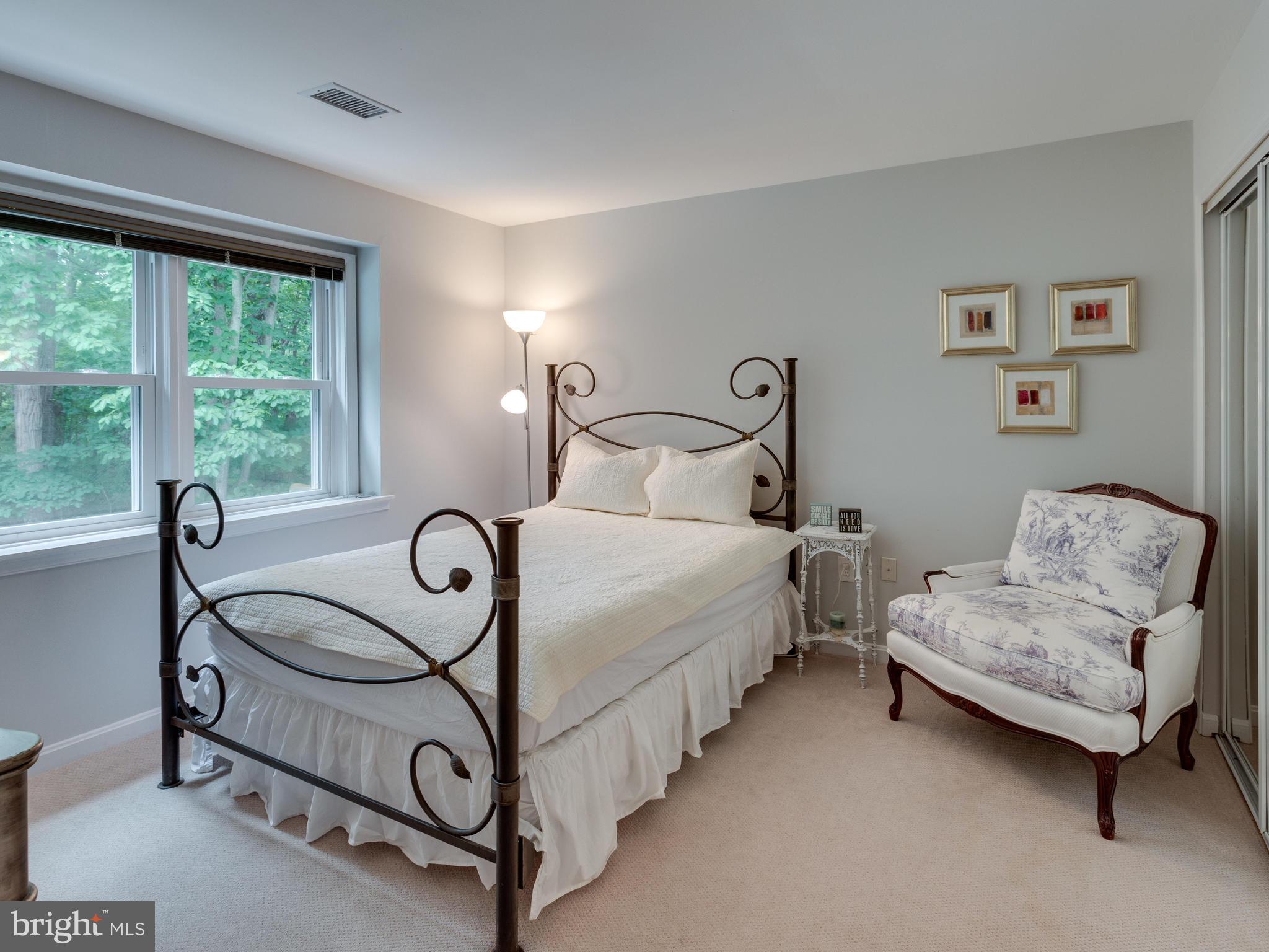 9031 Edgepark Road Vienna, VA 22182 - Photo 16 of 30 a bedroom with bed and a window