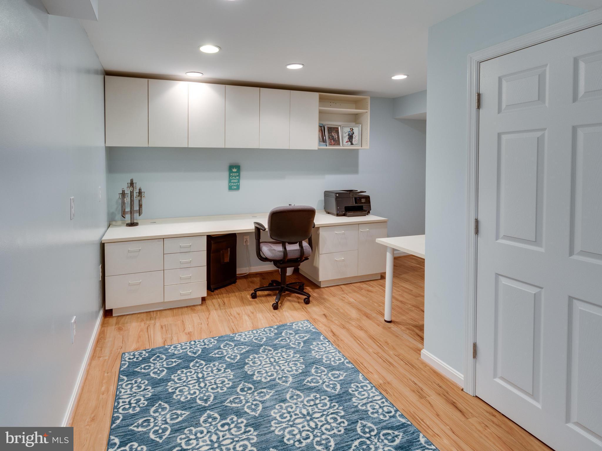 9031 Edgepark Road Vienna, VA 22182 - Photo 22 of 30 a workspace with wooden floor and windows