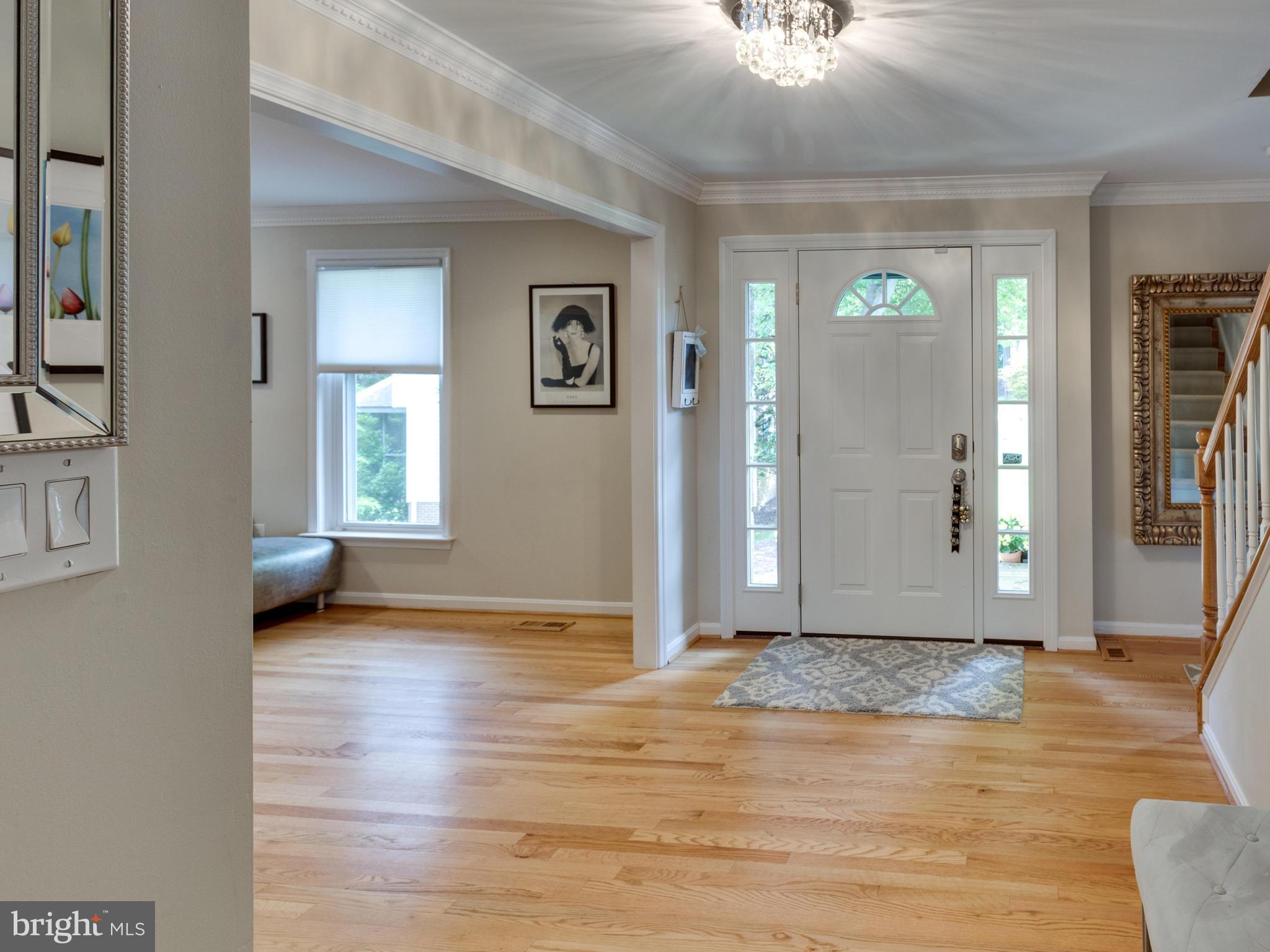 9031 Edgepark Road Vienna, VA 22182 - Photo 6 of 30 a view of livingroom with hardwood floor and hallway