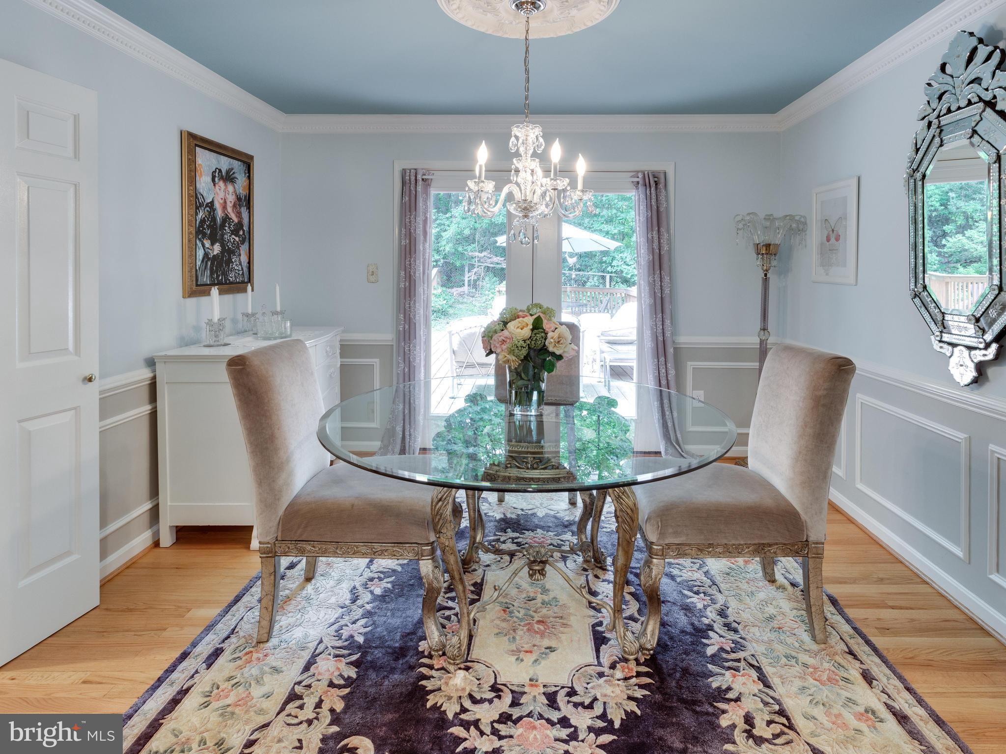 9031 Edgepark Road Vienna, VA 22182 - Photo 8 of 30 a living room with furniture and a chandelier