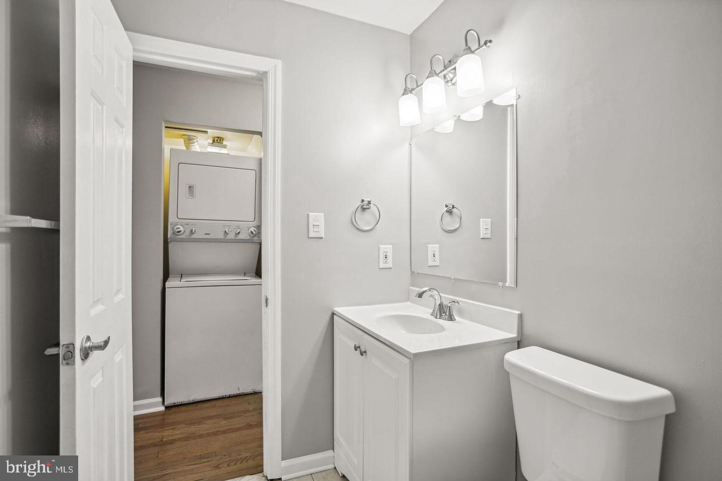 1507 Freedom Way Southeast, Unit 1 Washington, DC 20003 - Photo 12 of 15 a bathroom with a toilet a sink and mirror