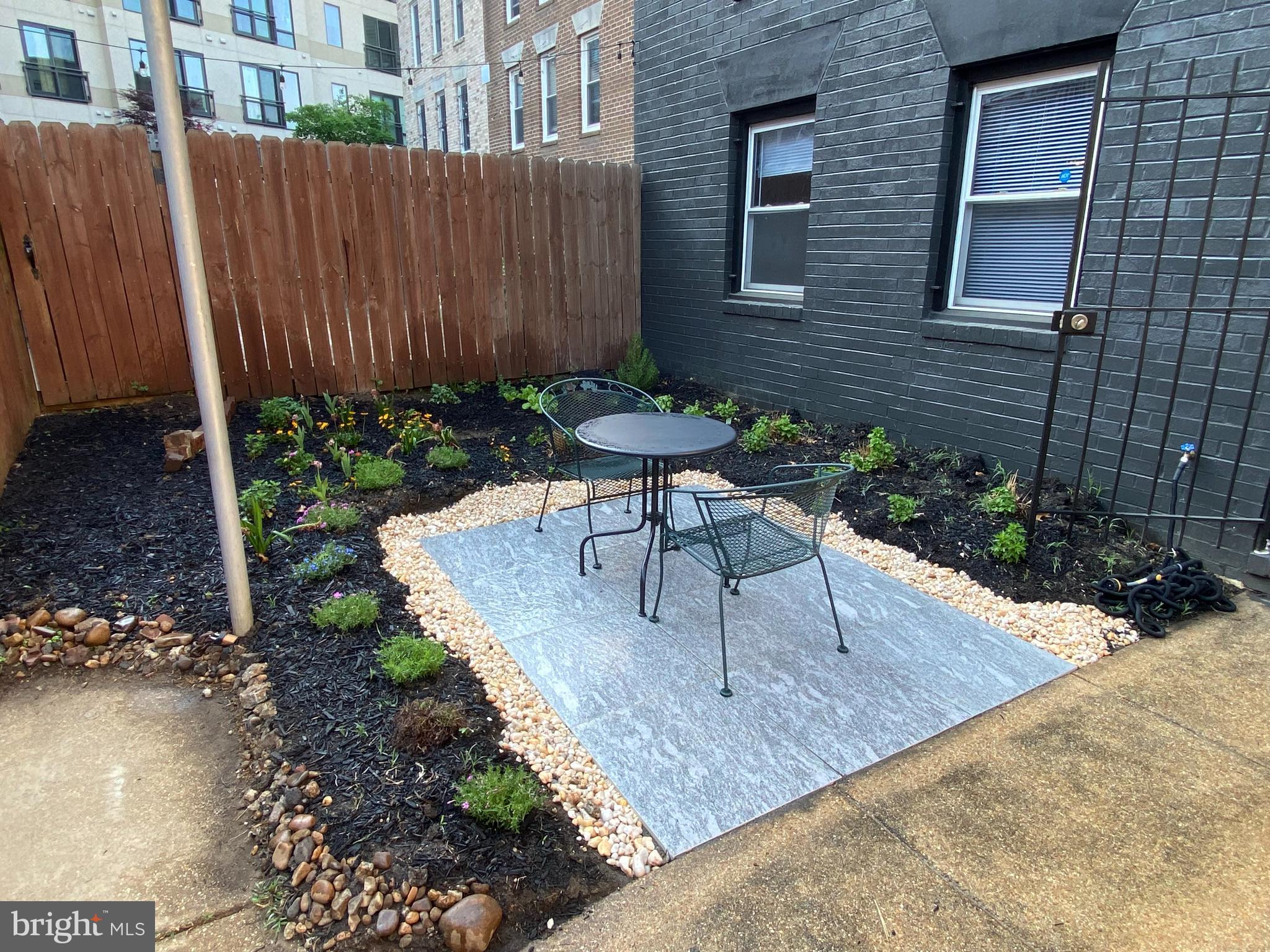1507 Freedom Way Southeast, Unit 1 Washington, DC 20003 - Photo 14 of 15 a view of a chairs and table in backyard of the house