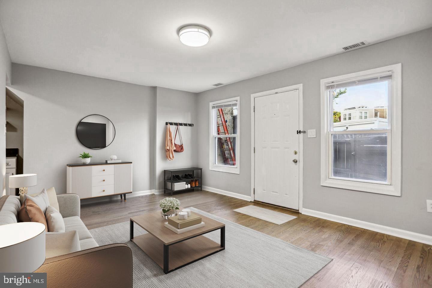 1507 Freedom Way Southeast, Unit 1 Washington, DC 20003 - Photo 2 of 15 a living room with furniture and a window