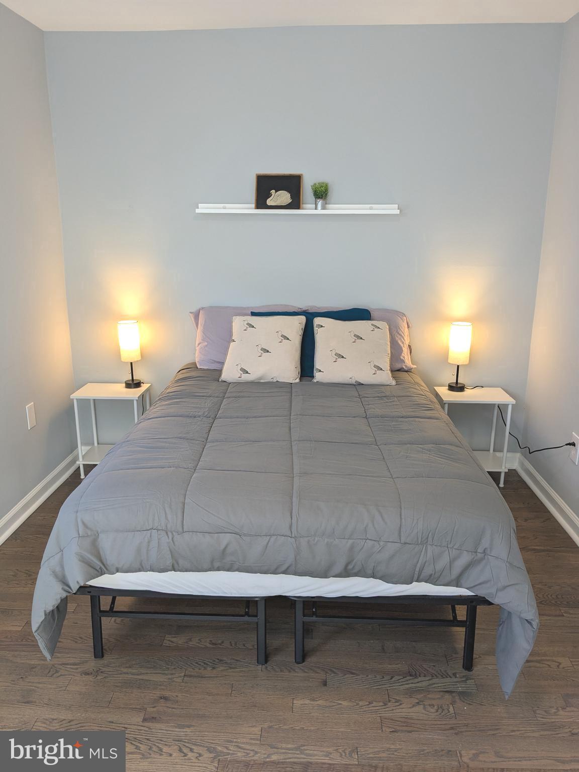 1507 Freedom Way Southeast, Unit 1 Washington, DC 20003 - Photo 8 of 15 a bedroom with a bed and lamp