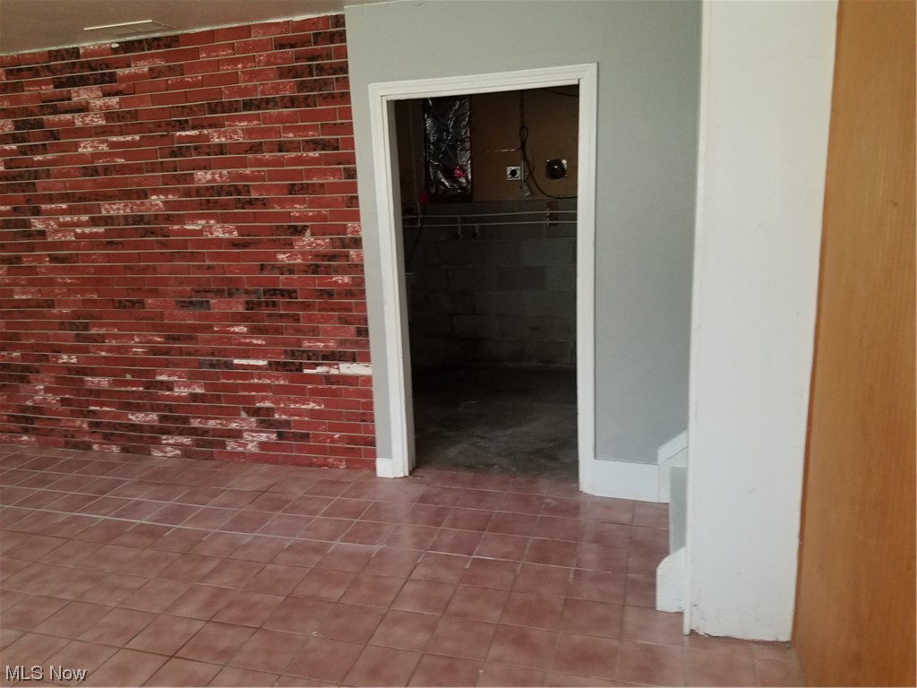 6389 Lear Nagle Road North Ridgeville, OH 44039 - Photo 24 of 35 spare room lower level leading to utility room