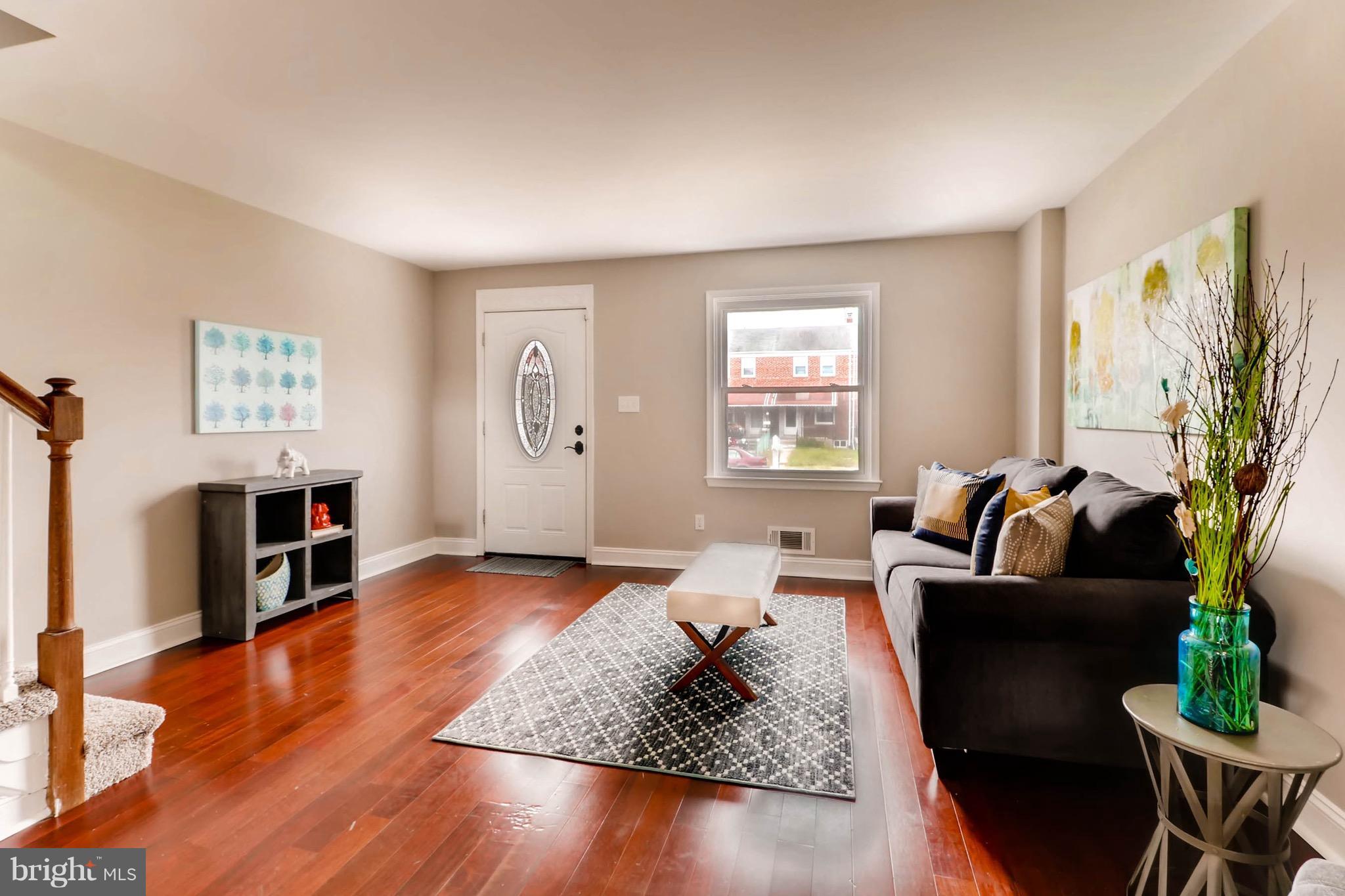2107 Redthorn Road Baltimore, MD 21220 - Photo 2 of 14 a living room with furniture and a wooden floor