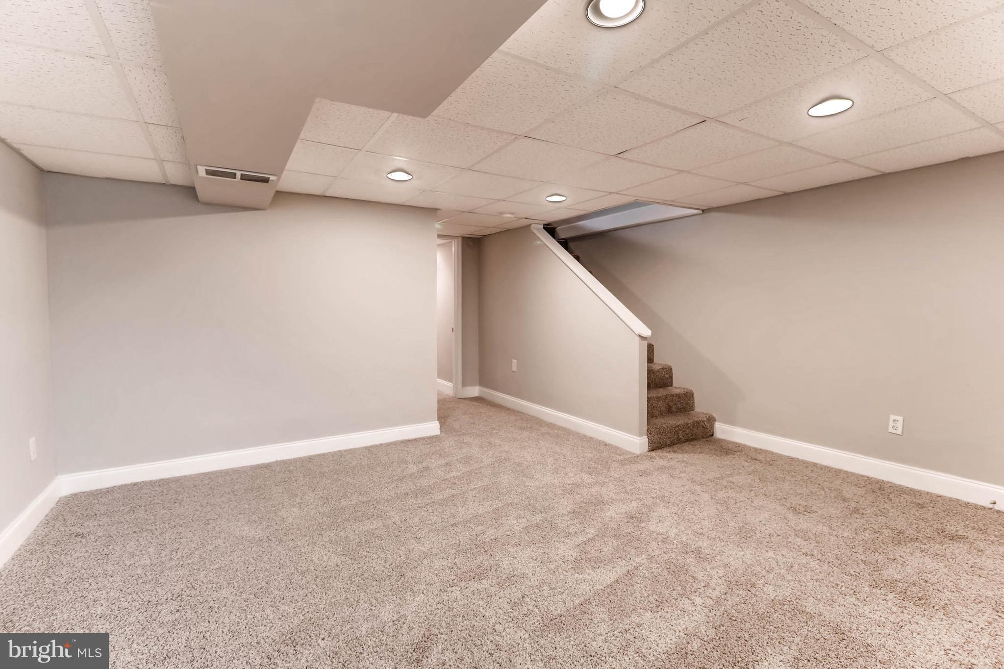 2107 Redthorn Road Baltimore, MD 21220 - Photo 11 of 14 wooden floor in an empty room with a window