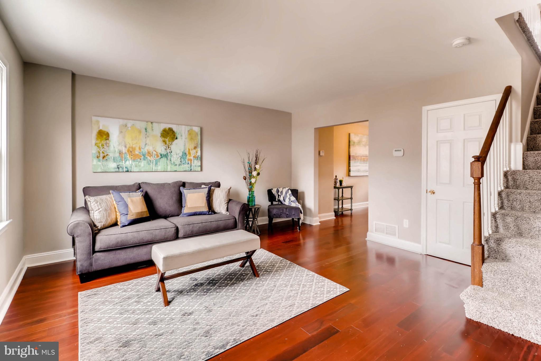 2107 Redthorn Road Baltimore, MD 21220 - Photo 3 of 14 a living room with furniture and a wooden floor