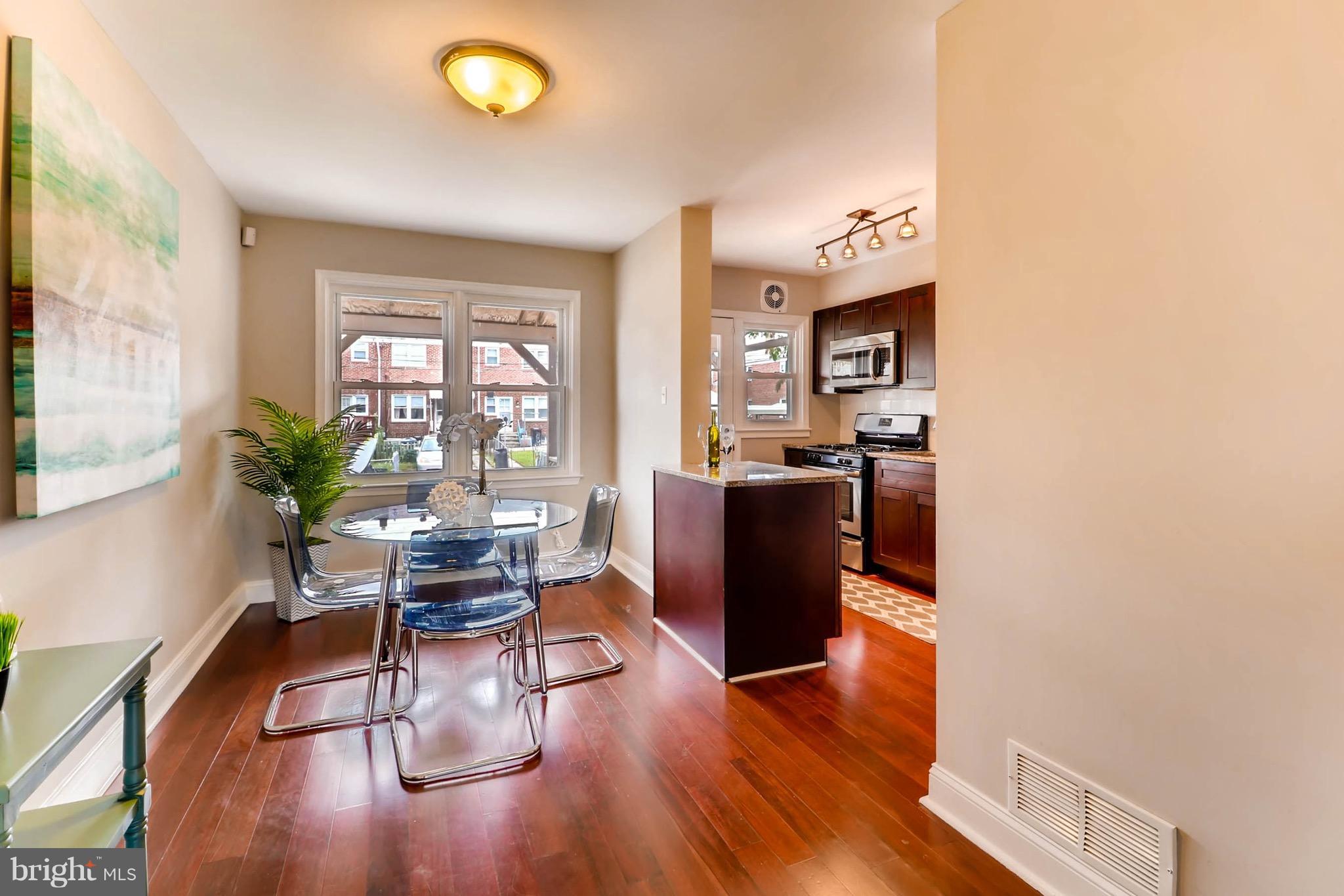 2107 Redthorn Road Baltimore, MD 21220 - Photo 4 of 14 a view of a dining room with furniture window and wooden floor