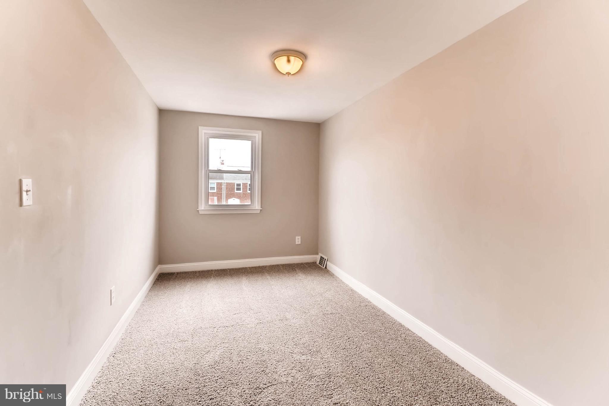 2107 Redthorn Road Baltimore, MD 21220 - Photo 9 of 14 an empty room with a window