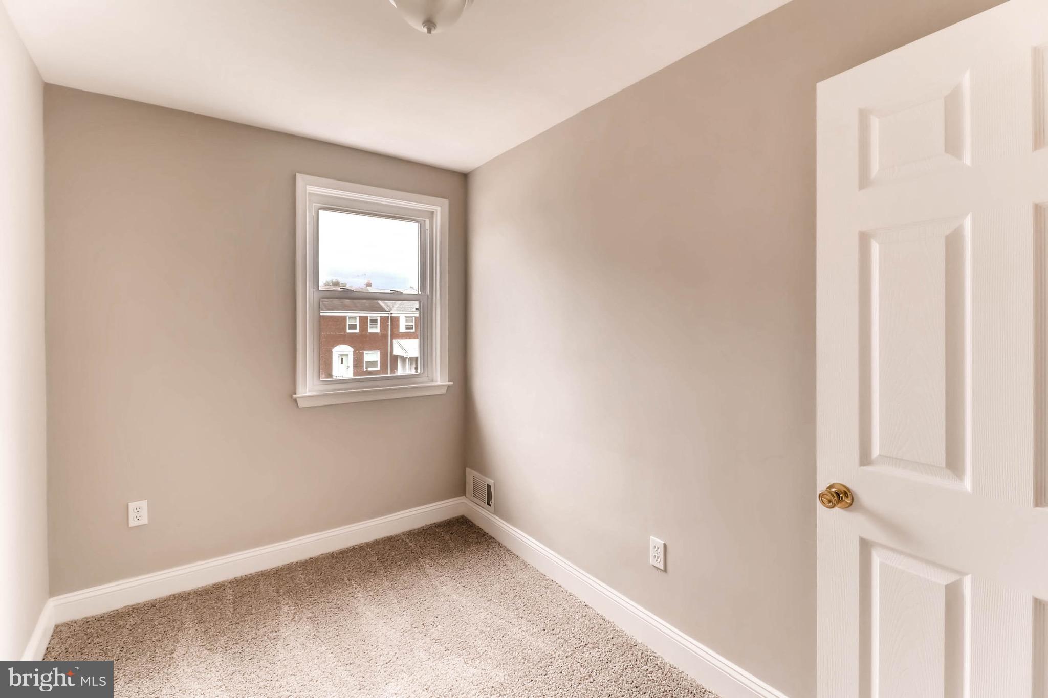2107 Redthorn Road Baltimore, MD 21220 - Photo 10 of 14 a view of an empty room with a window