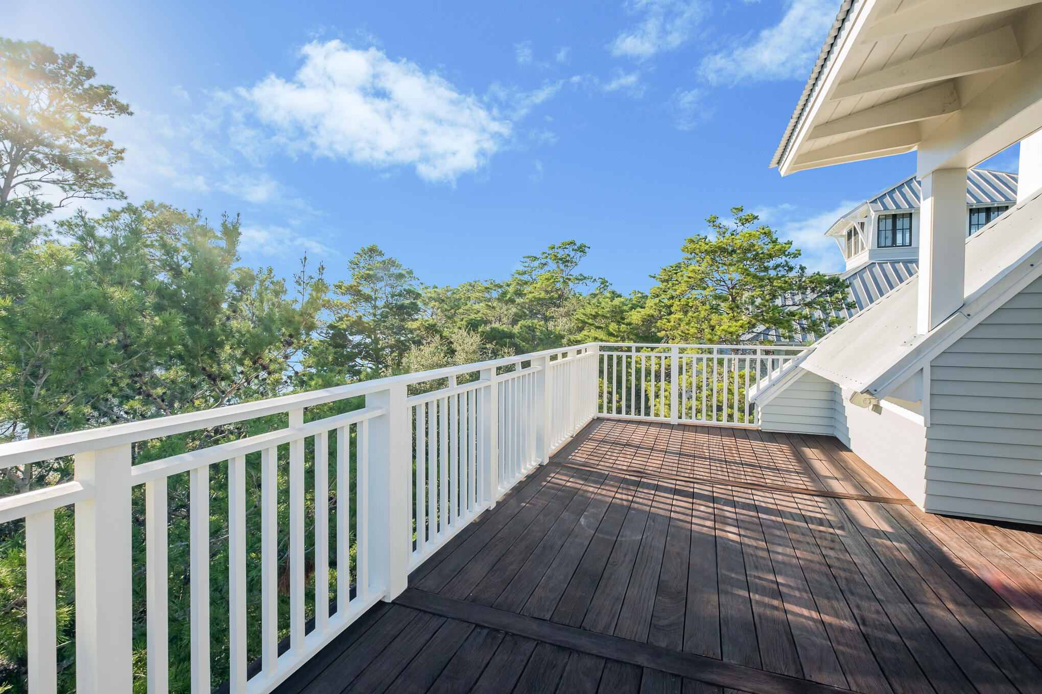 127 Blackwater Street Santa Rosa Beach, FL 32459 - Photo 66 of 97 a view of a balcony with wooden floor and fence