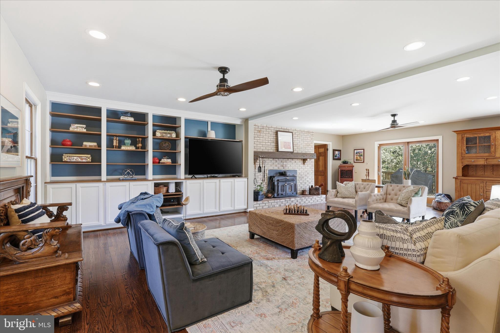 5605 Smoke Rise Lane Fairfax Station, VA 22039 - Photo 19 of 86 a living room with furniture and a flat screen tv