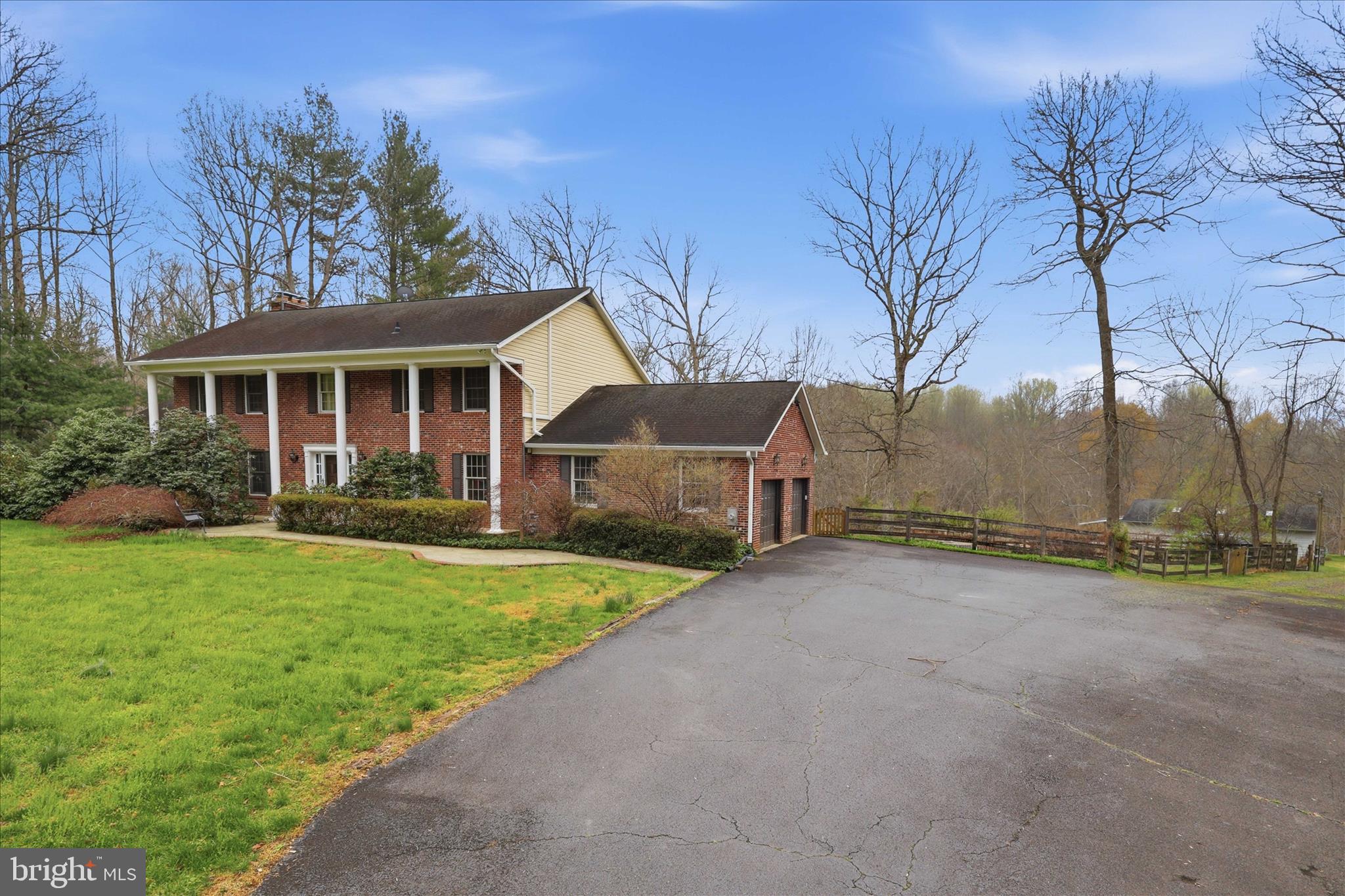 5605 Smoke Rise Lane Fairfax Station, VA 22039 - Photo 2 of 85 a view of a house with backyard and garden