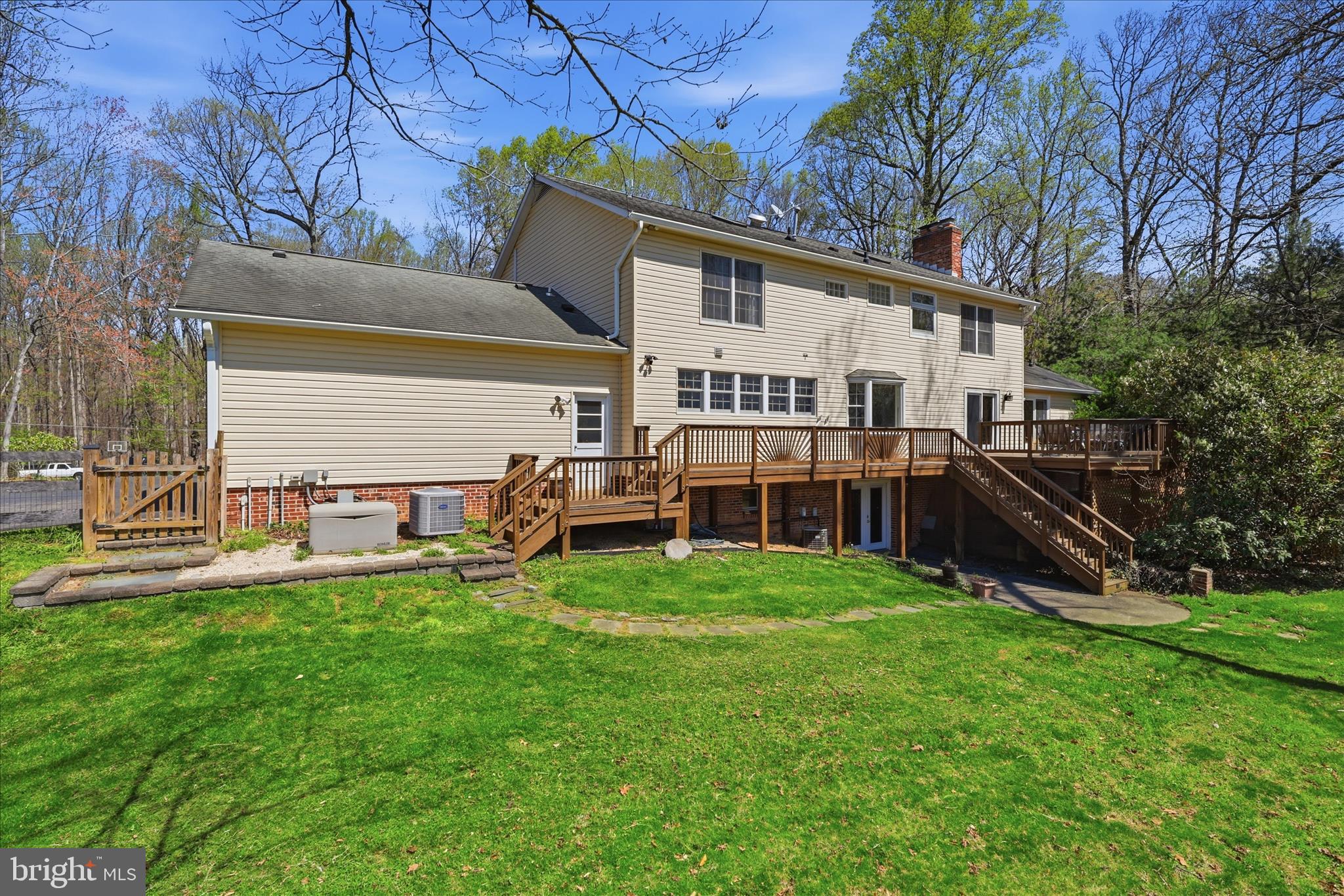 5605 Smoke Rise Lane Fairfax Station, VA 22039 - Photo 45 of 86 a view of a house with a yard and sitting area