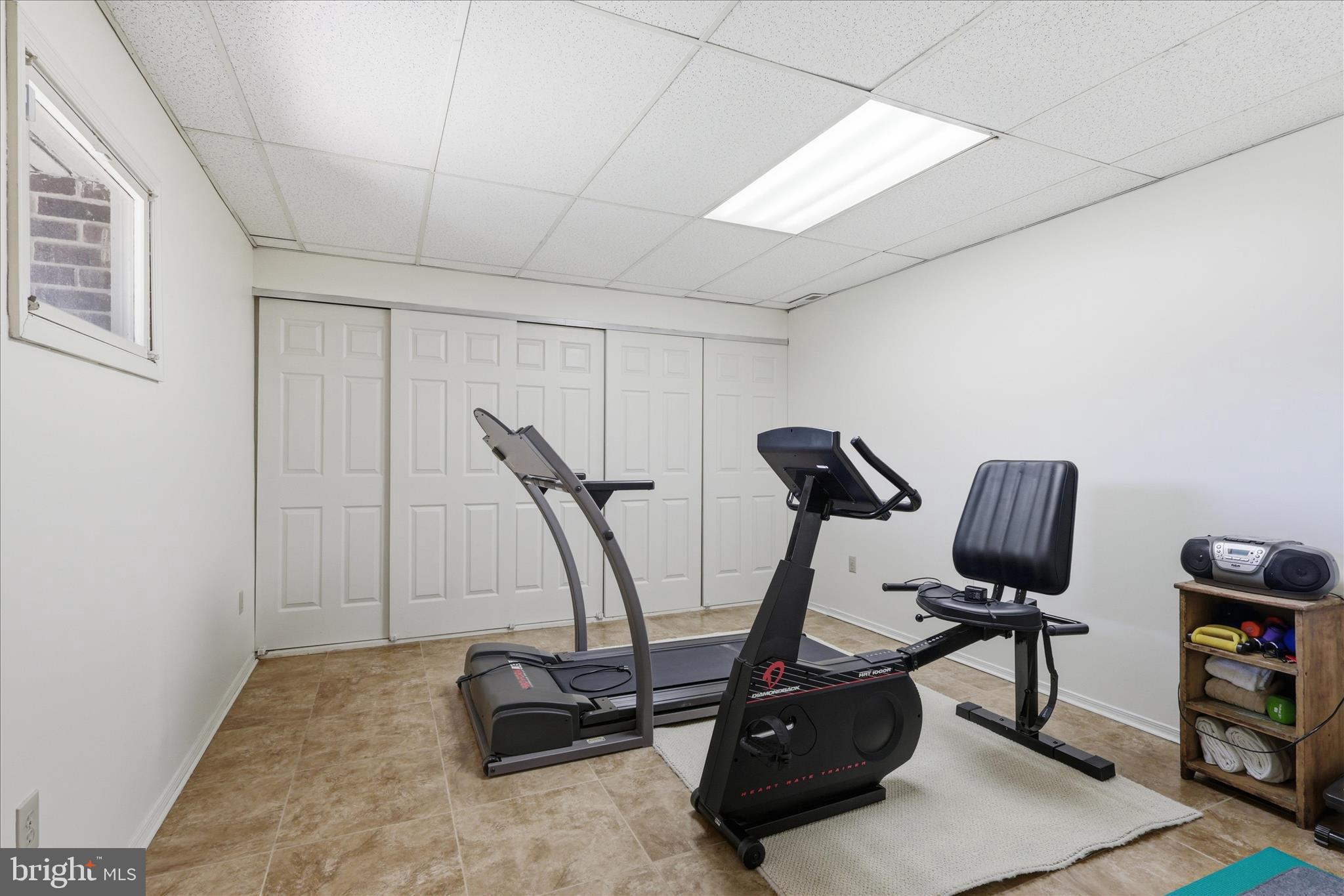 5605 Smoke Rise Lane Fairfax Station, VA 22039 - Photo 48 of 85 a view of a room with gym equipment