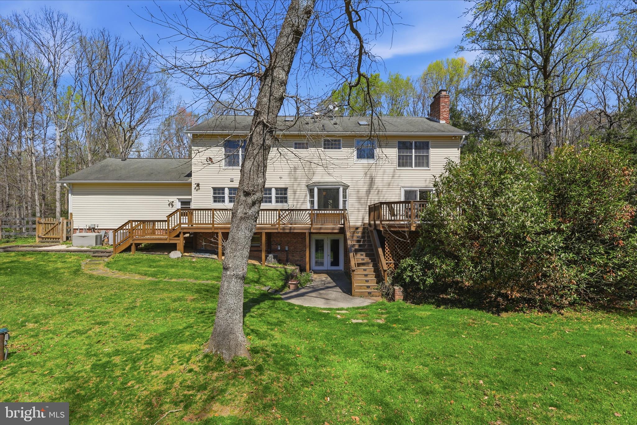 5605 Smoke Rise Lane Fairfax Station, VA 22039 - Photo 50 of 85 a view of a house with a backyard porch and sitting area