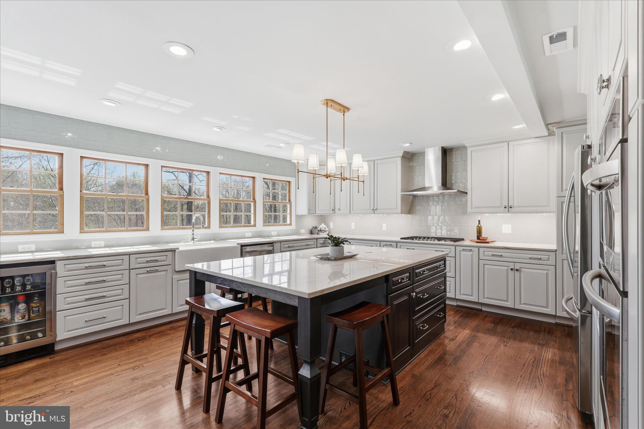 5605 Smoke Rise Lane Fairfax Station, VA 22039 - Photo 5 of 86 a kitchen with stainless steel appliances granite countertop a kitchen island hardwood floor and a sink