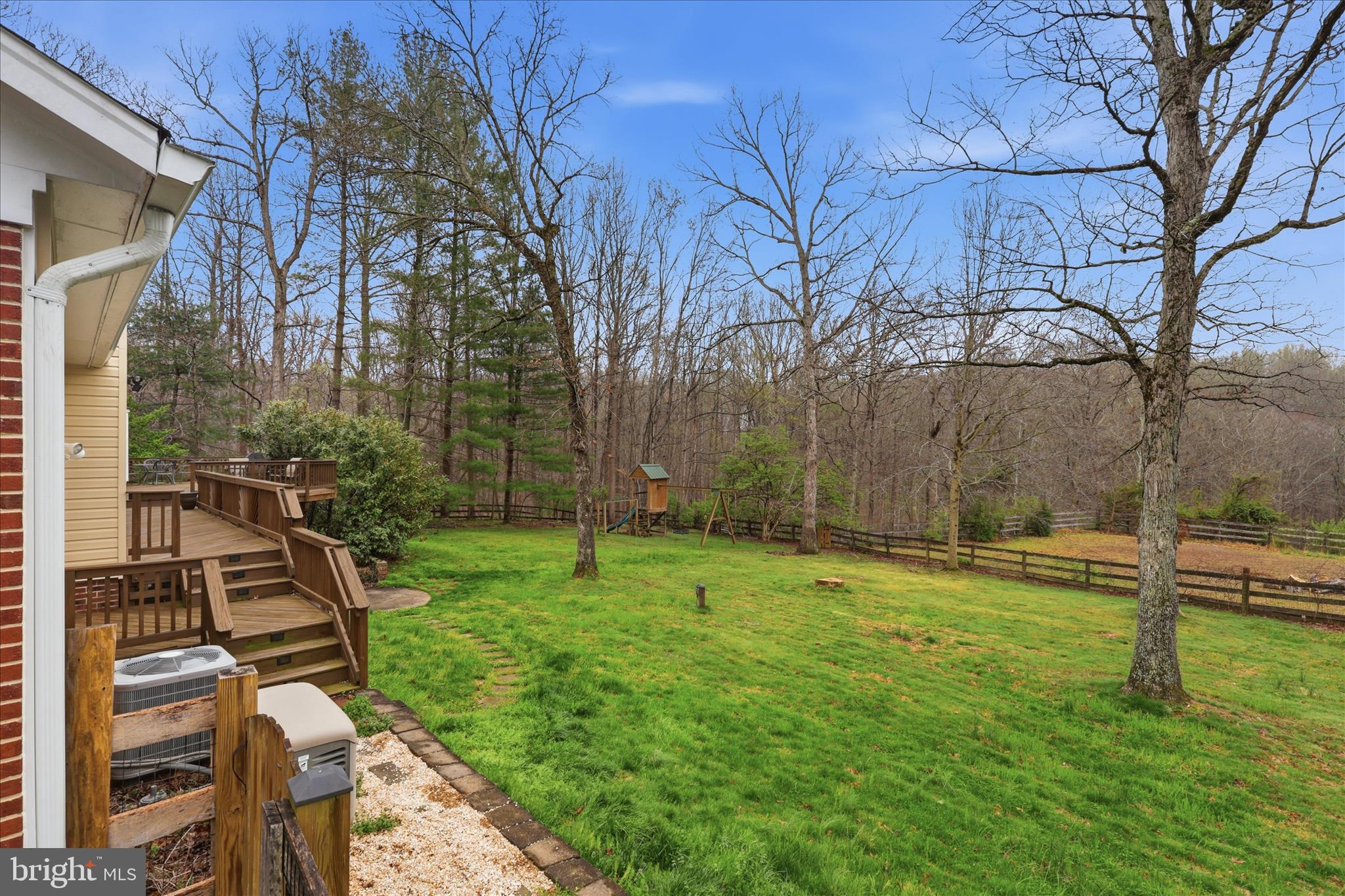 5605 Smoke Rise Lane Fairfax Station, VA 22039 - Photo 54 of 85 a view of a backyard with wooden fence