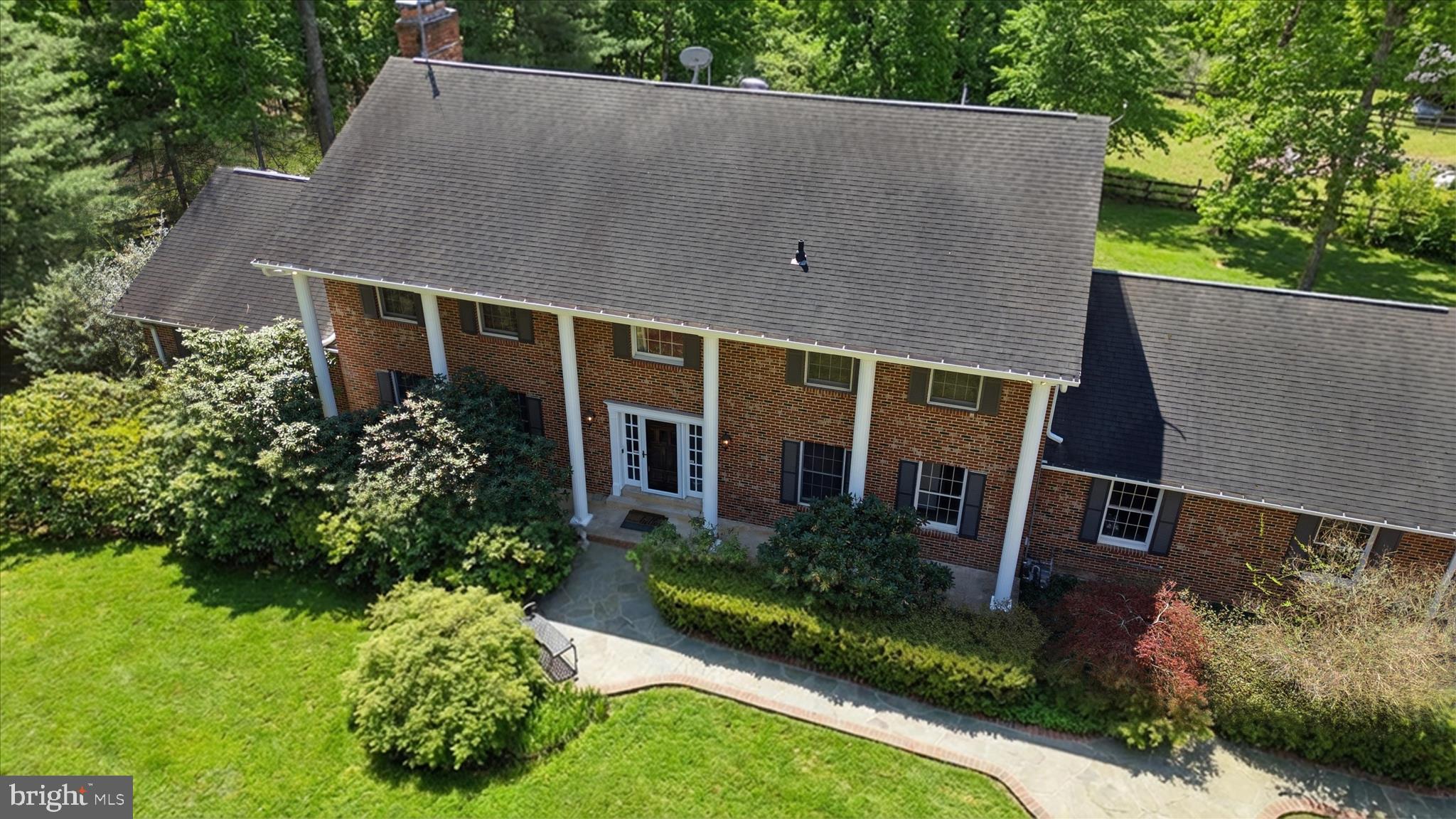 5605 Smoke Rise Lane Fairfax Station, VA 22039 - Photo 59 of 86 an aerial view of a house with a yard and potted plants
