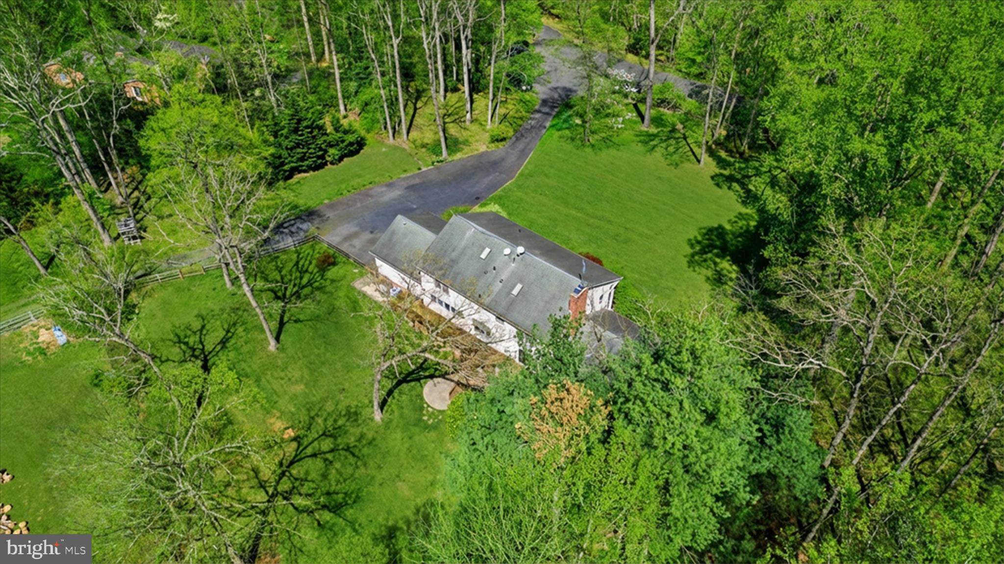5605 Smoke Rise Lane Fairfax Station, VA 22039 - Photo 74 of 85 an aerial view of a house with a yard