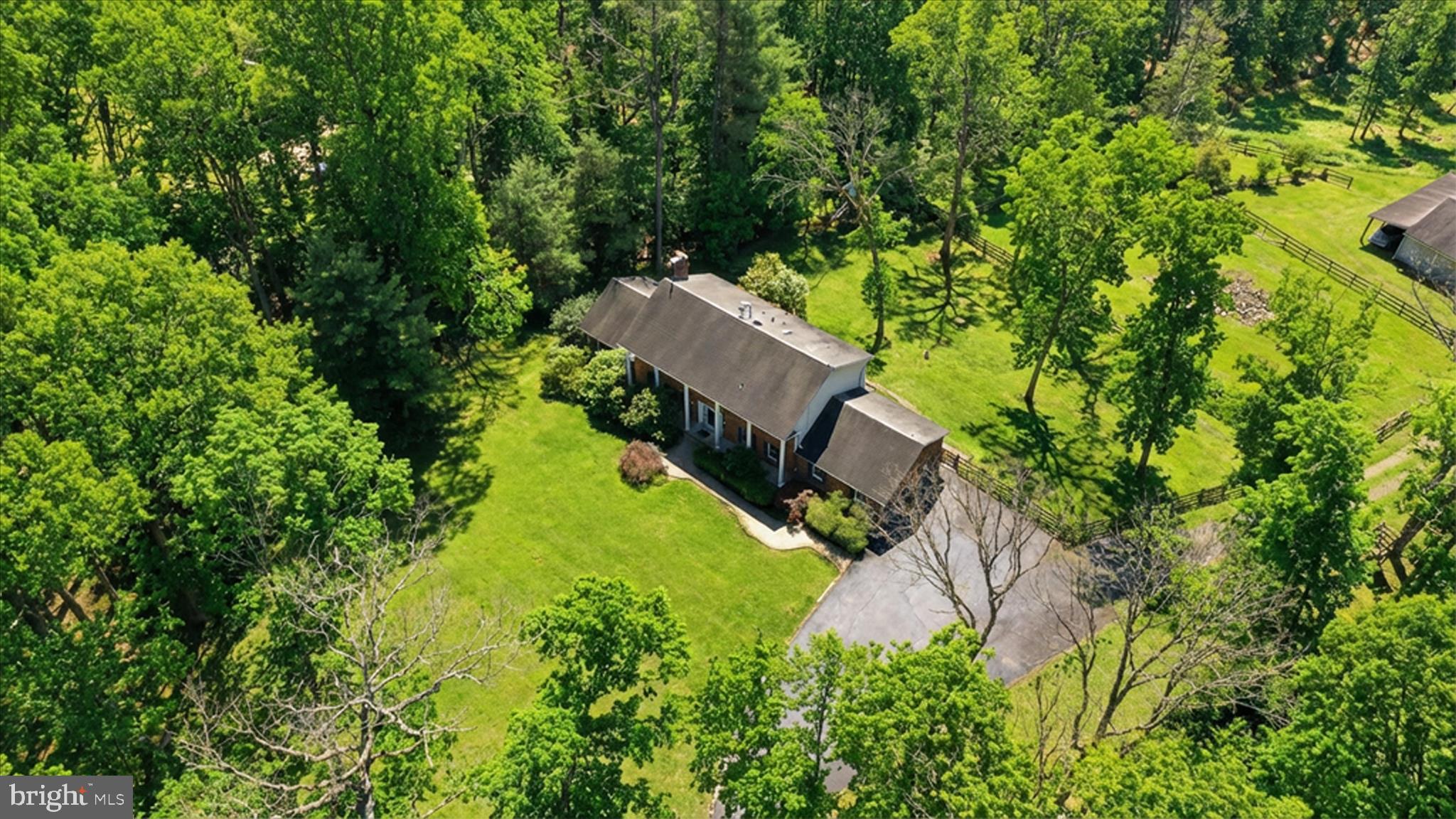5605 Smoke Rise Lane Fairfax Station, VA 22039 - Photo 76 of 85 an aerial view of a house with a yard