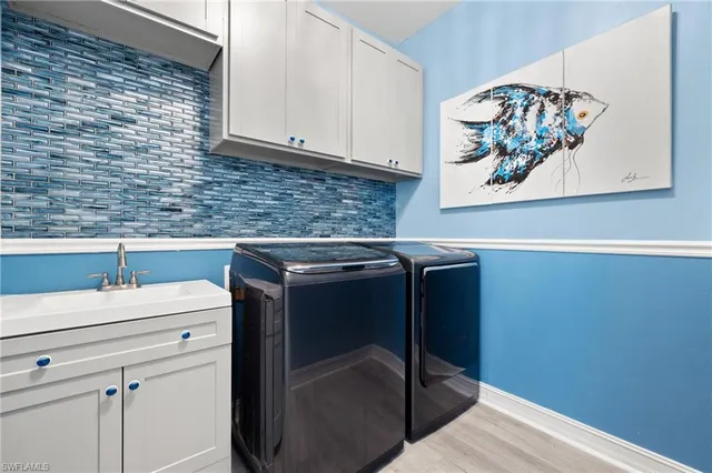 a utility room with dryer and washer