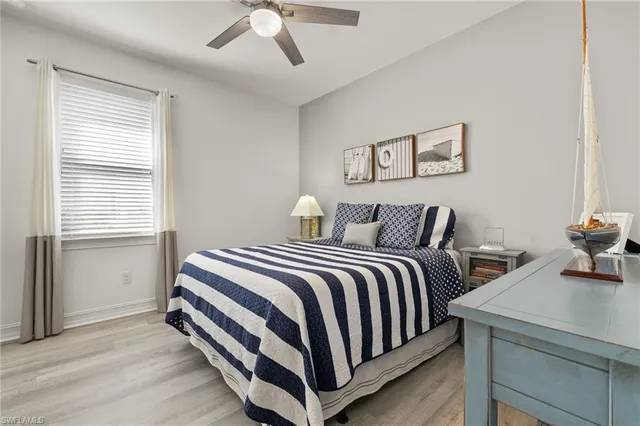 a bedroom with a bed and a table