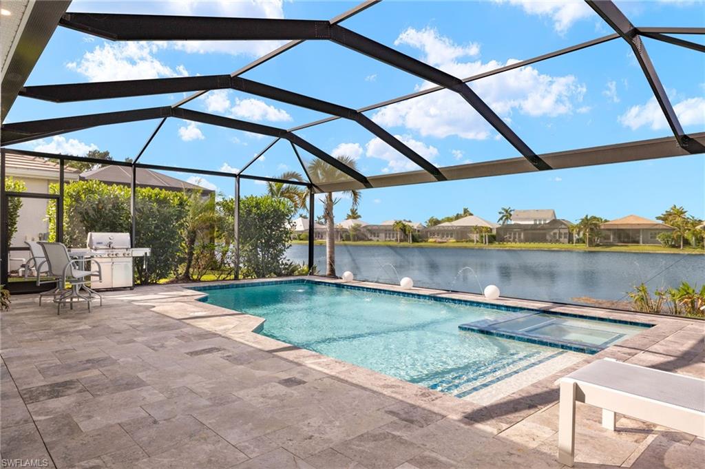 14651 Topsail Drive Naples, FL 34114 - Photo 22 of 37 a backyard of a house with table and chairs