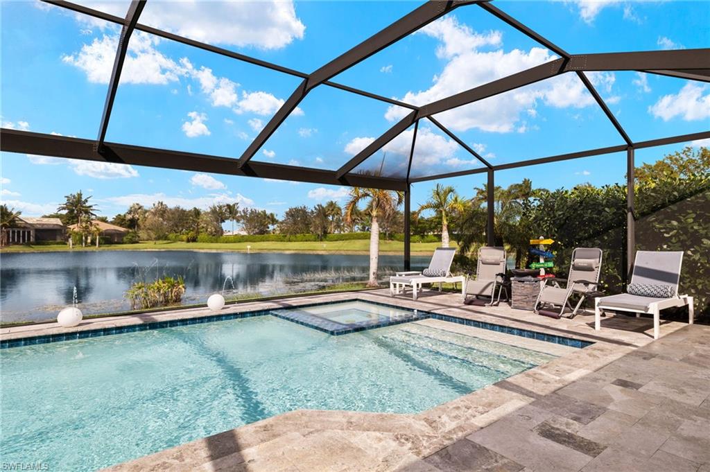14651 Topsail Drive Naples, FL 34114 - Photo 23 of 37 a view of a swimming pool with a patio
