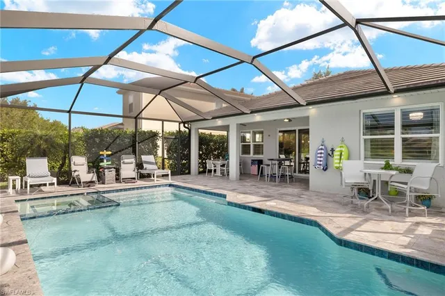 a view of a backyard with a swimming pool