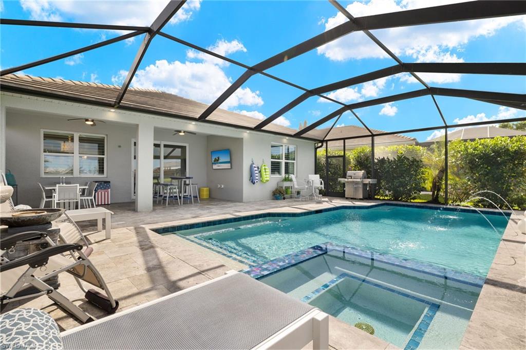 14651 Topsail Drive Naples, FL 34114 - Photo 26 of 37 a view of outdoor space yard deck patio and swimming pool