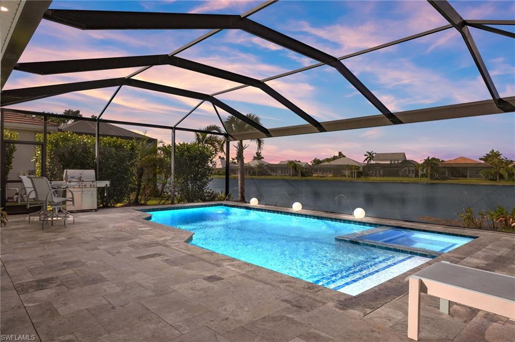 14651 Topsail Drive Naples, FL 34114 - Photo 28 of 37 a view of swimming pool with a patio