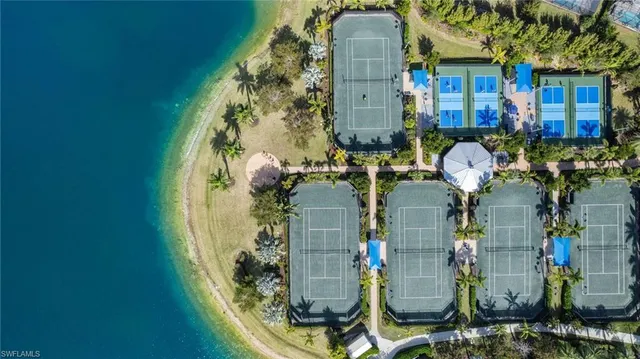 an aerial view of a house with a lake view