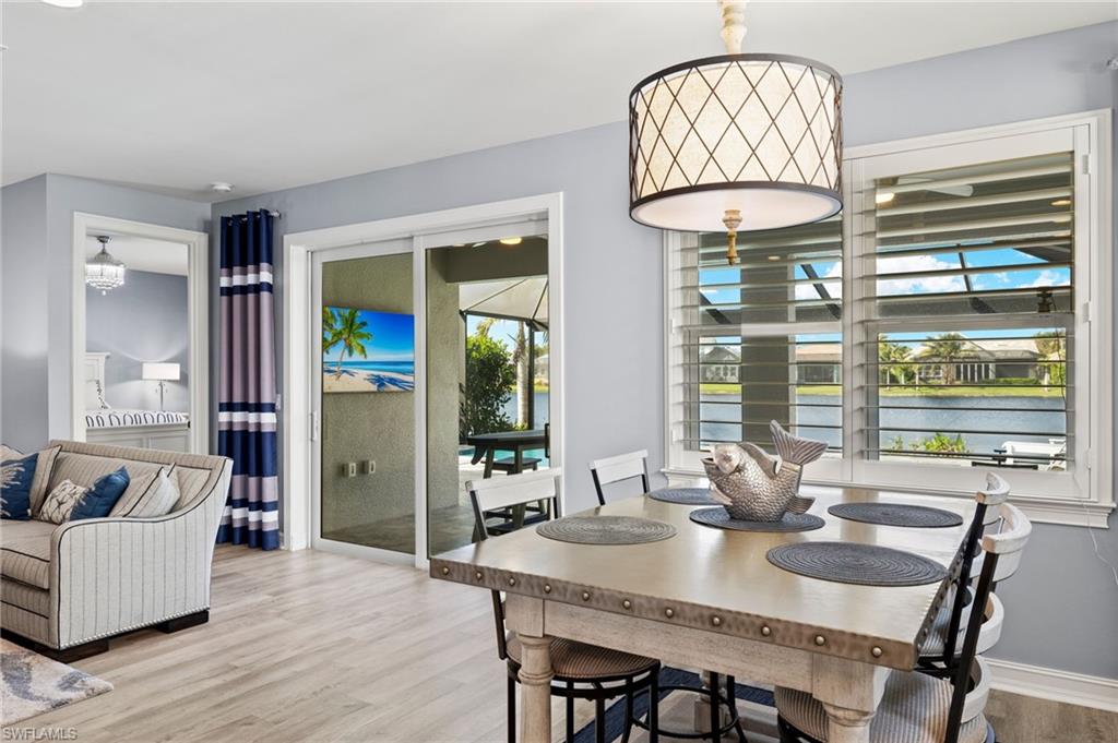 14651 Topsail Drive Naples, FL 34114 - Photo 10 of 37 a view of a dining room with furniture window and outside view