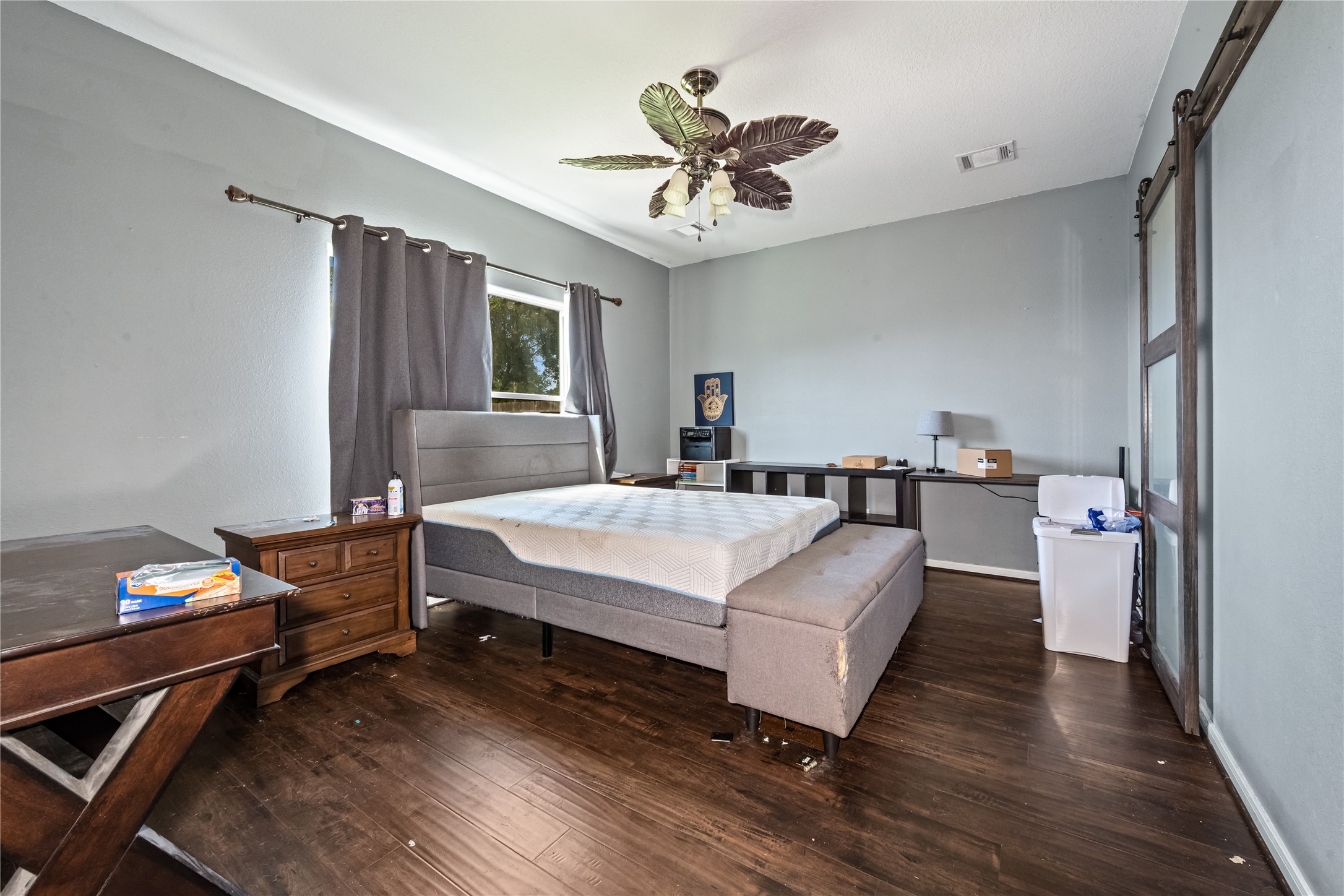 28832 San Bernard River Loop Spring, TX 77386 - Photo 19 of 50 a bedroom with bed and a chandelier