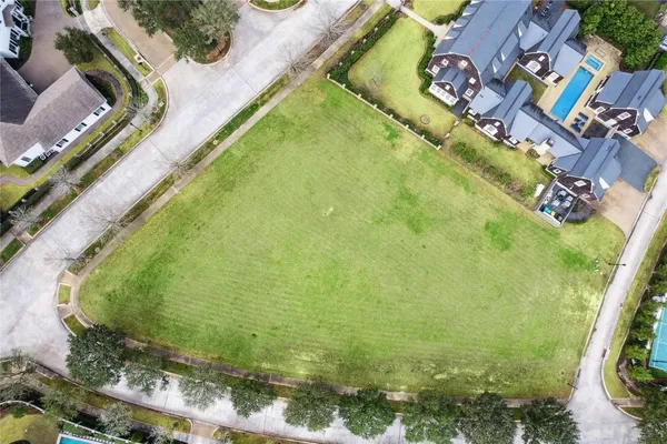 a view of a swimming pool with a yard