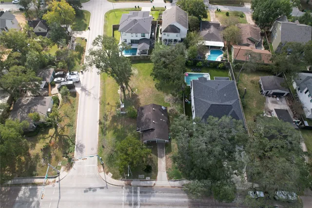 an aerial view of a house with outdoor space