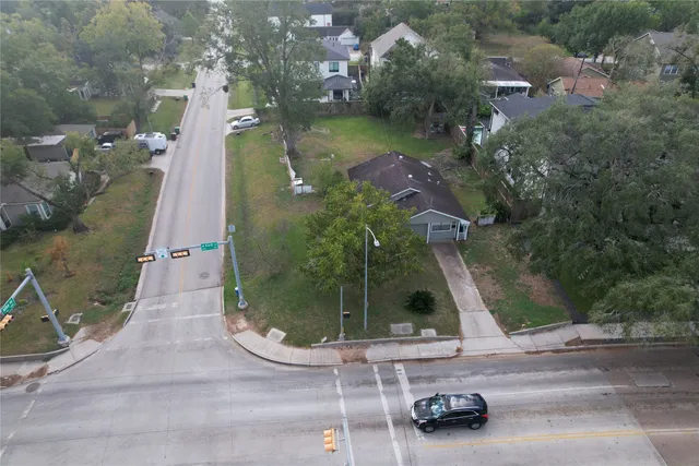 a view of house with a backyard