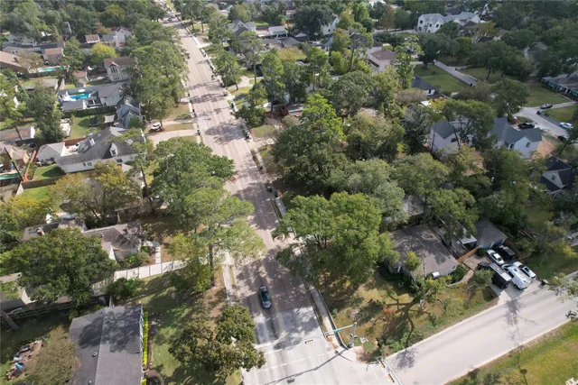 an aerial view of multiple houses with yard