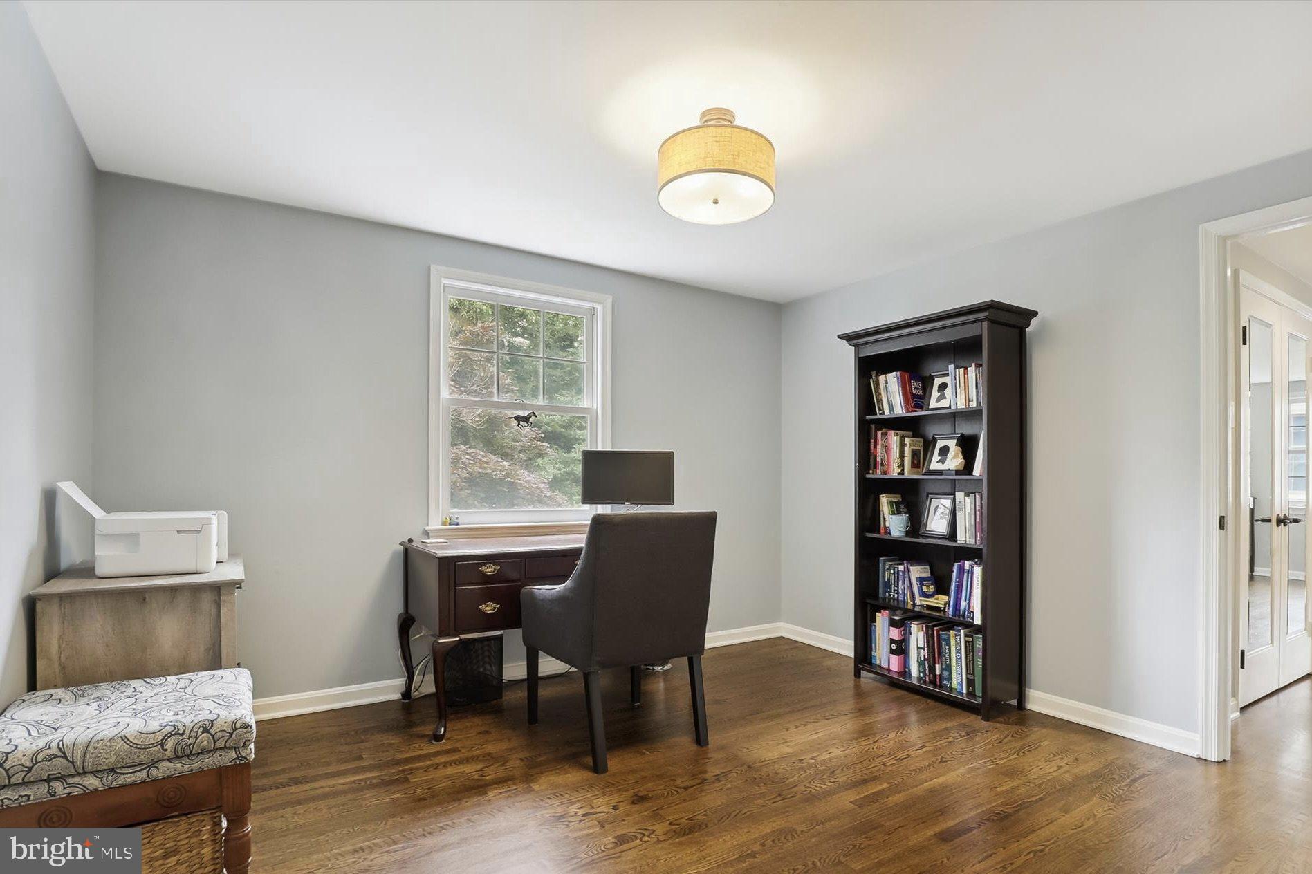 11310 Rolling House Road North Bethesda, MD 20852 - Photo 11 of 26 a view of a workspace with furniture and a window