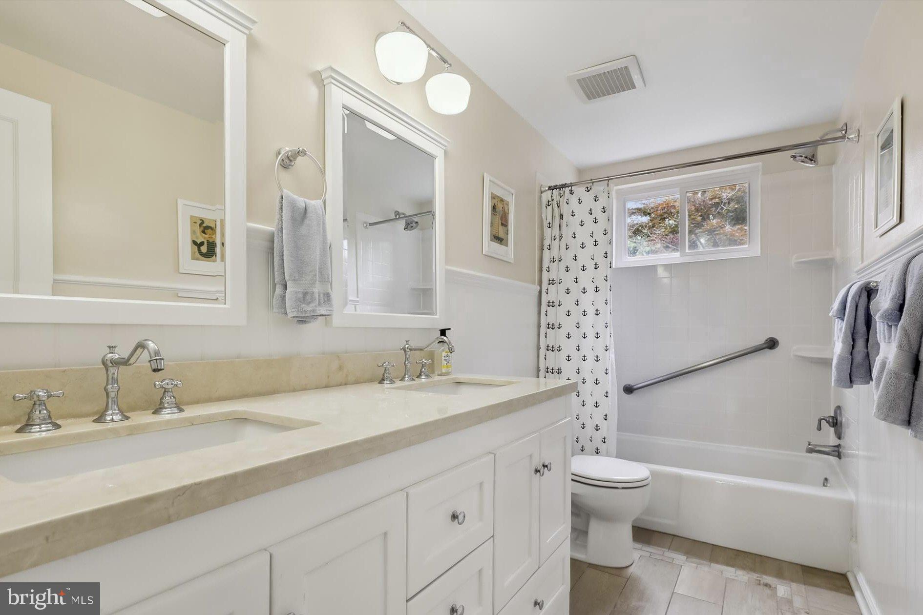11310 Rolling House Road North Bethesda, MD 20852 - Photo 15 of 26 a bathroom with a sink a toilet and a bathtub