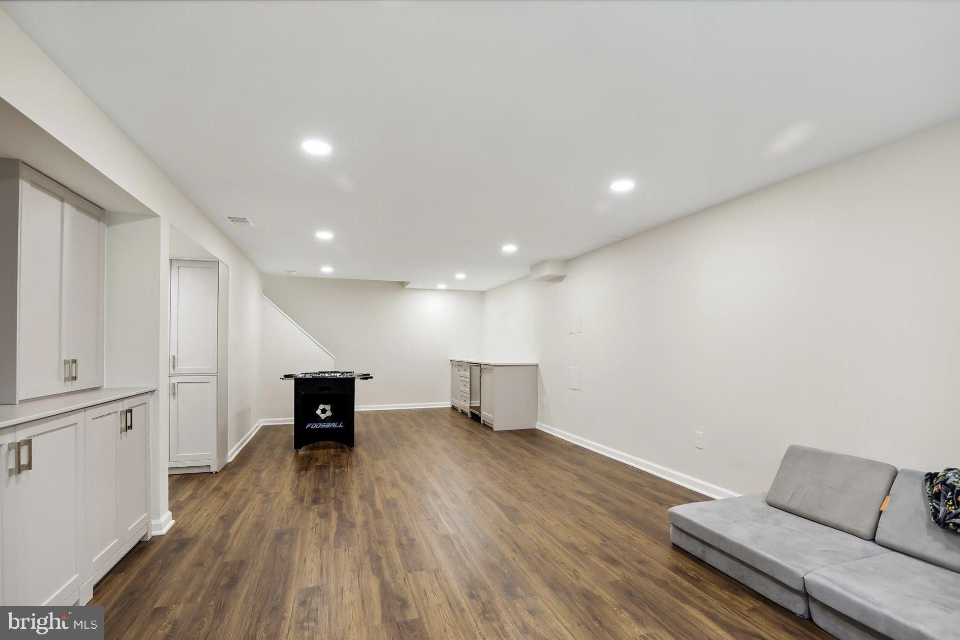 11310 Rolling House Road North Bethesda, MD 20852 - Photo 19 of 26 a living room with furniture and a wooden floor