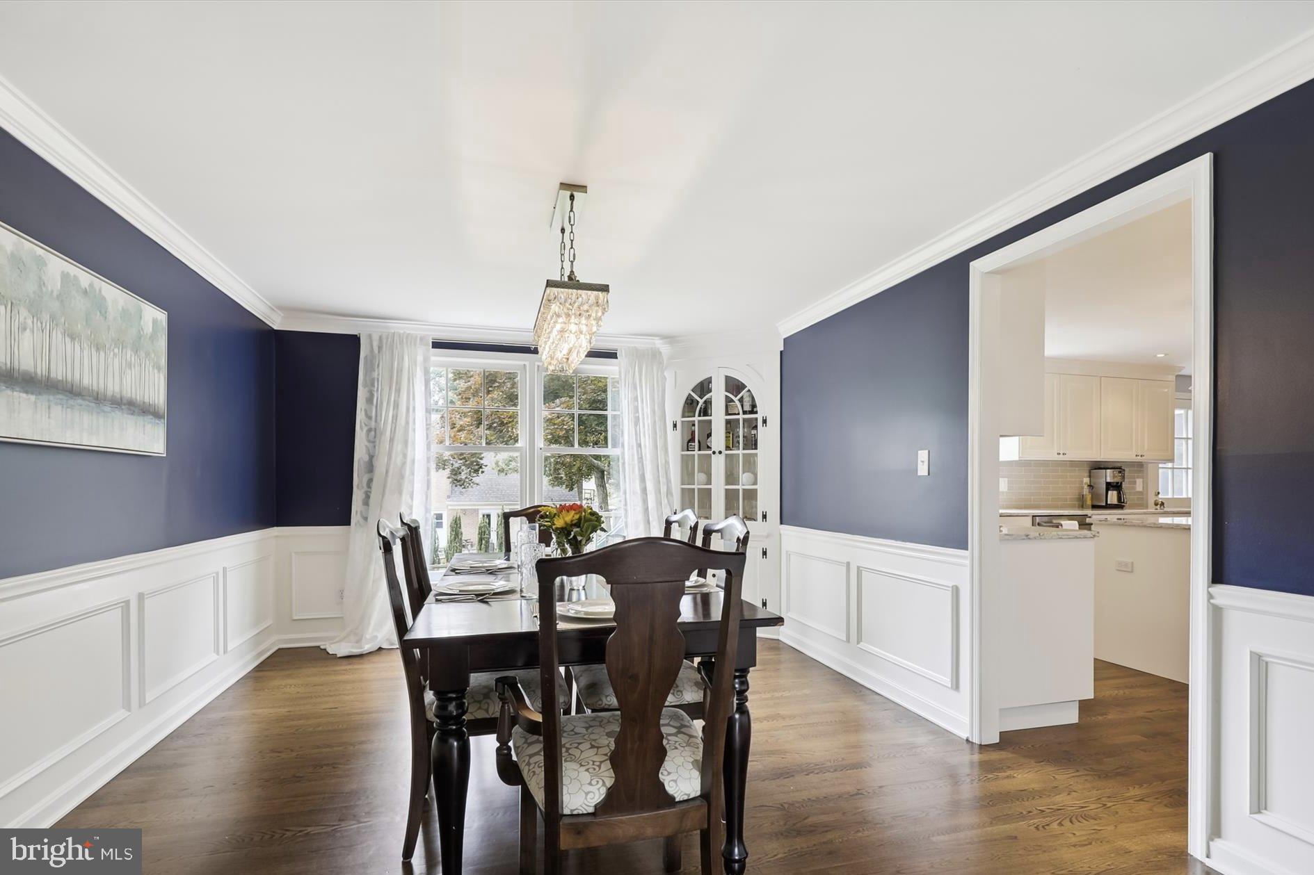 11310 Rolling House Road North Bethesda, MD 20852 - Photo 7 of 26 a view of a dining room with furniture window and wooden floor