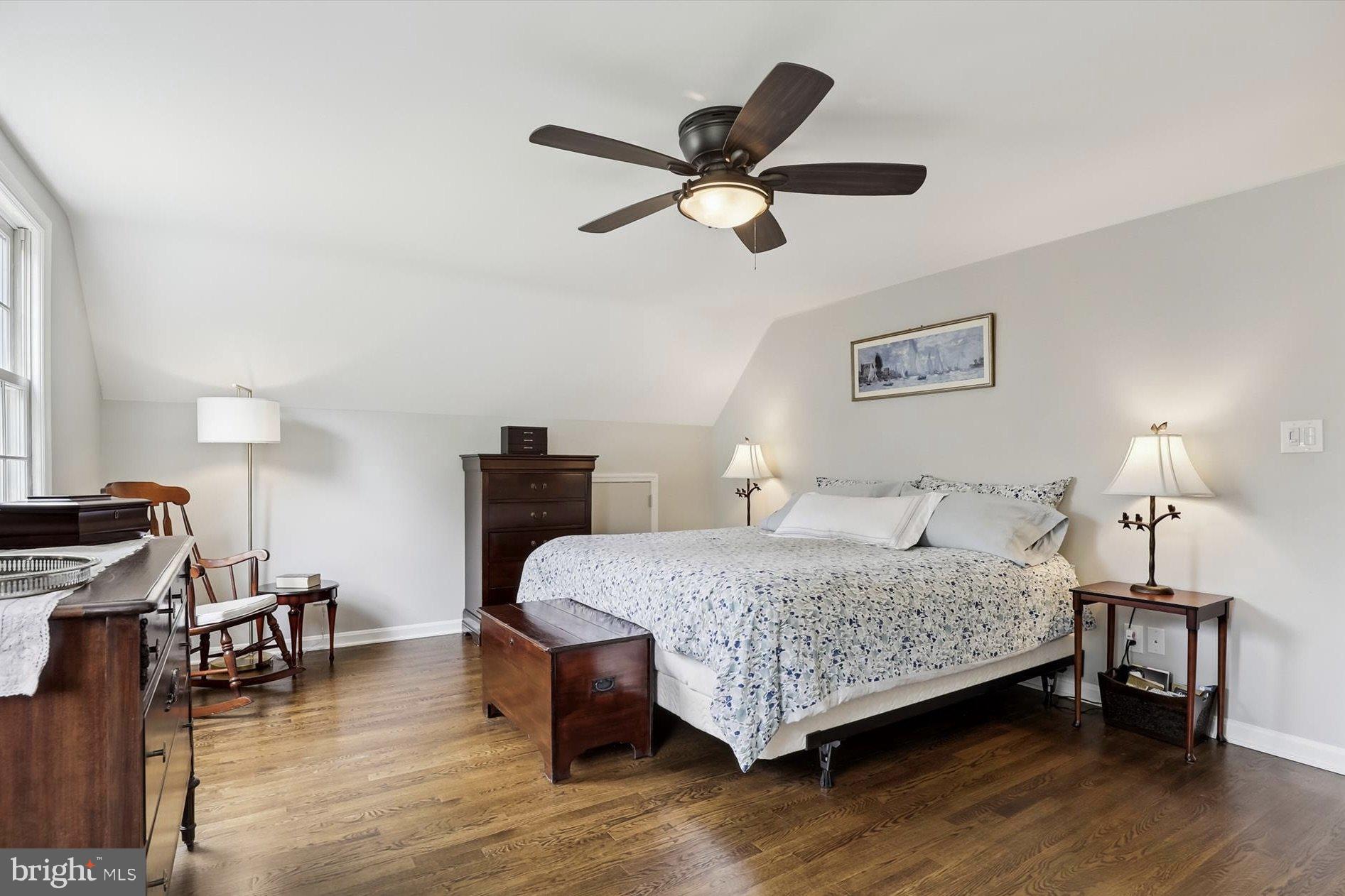 11310 Rolling House Road North Bethesda, MD 20852 - Photo 10 of 26 a bedroom with a bed and a chandelier