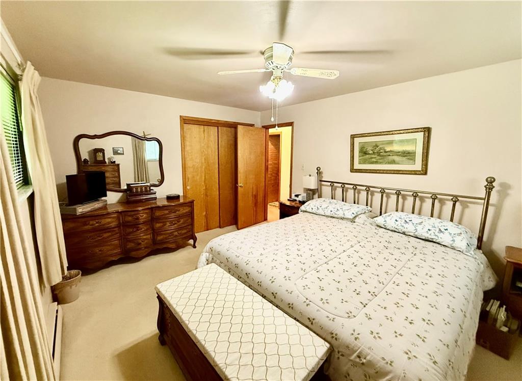 320 Saxonburg Road Butler, PA 16002 - Photo 20 of 36 a bedroom with a bed mirror on dresser and a large mirror