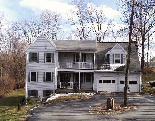 106 Old Ridge Road New Milford, CT 06776 - Photo 1 of 1 a front view of a house with yard and trees in the background