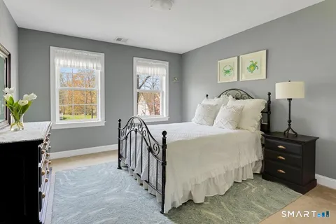 a bedroom with a bed and a table